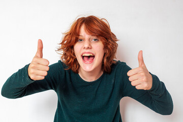 portrait of a pensive teenage girl with red hair with a stylish anime hairstyle