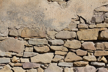 a close up of a  old damaged stone wall