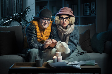 Frustrated couple feeling cold at home