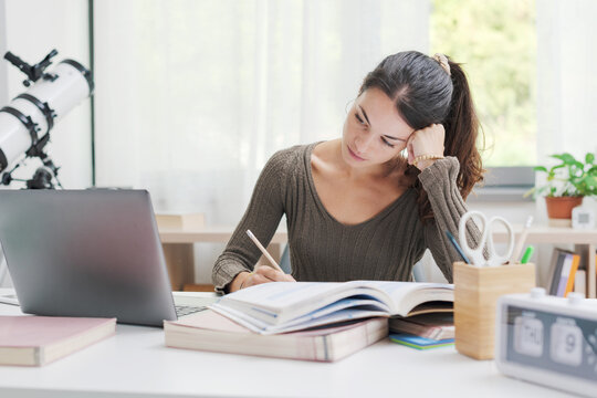 Young woman studying at home