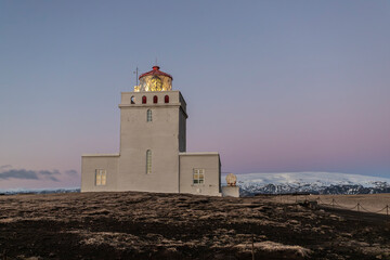 Dyrhólaey viewpoint lighthouse with Katla in background in Iceland