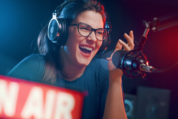 Cheerful woman hosting a radio show
