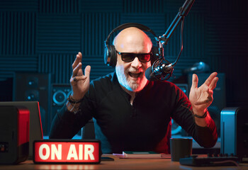 Radio presenter talking into the microphone