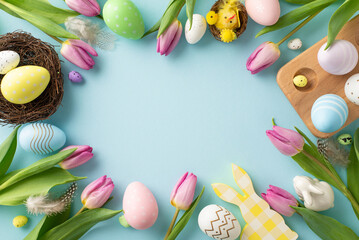 Pastel perfection: Top view of lively eggs, cute bunnies, nests, chicken, feathers, tulips in container on soothing blue background. Delightful Easter-themed image with space for text or promotions