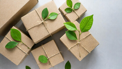 Heap of cardboard boxes from natural recyclable materials with green leaves sprout top view. Responsible consumption, eco friendly packaging, zero waste concept