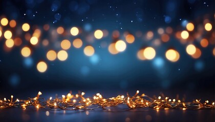 Fototapeta na wymiar Garland bokeh lights over dark blue background