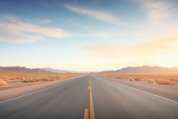 desert highway vanishing into the horizon at sunrise - obrazy, fototapety, plakaty