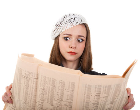 Young cute brunette girl and newspaper