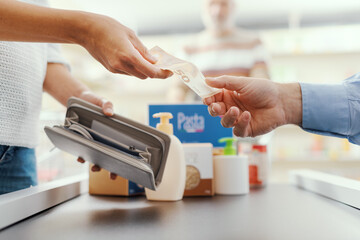 Cash payment at the supermarket - obrazy, fototapety, plakaty