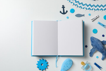 Blue children's book, with toys, on a white background.