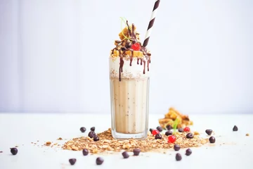 Fotobehang malted milk milkshake with malt balls and chocolate drizzle © altitudevisual