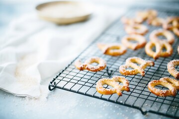 freshly baked pretzels on a cooling rack