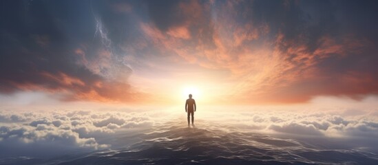 Fototapeta premium Man stands on the edge of the abyss and looks at the sea. alone person looking at heaven.