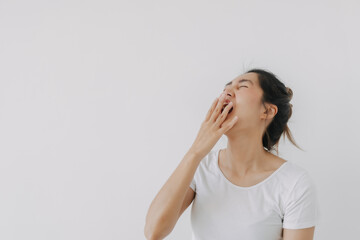 Happy asian Thai woman hand covering mouth while laughing, feeling glad wear white and bun...