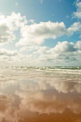 Reflection of the sky and clouds in the water. Baltic Sea.
