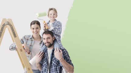 Happy family painting their new house