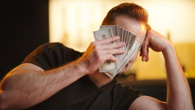 Upset man wipe tears with stack of money banknotes sarcastic meme 4K