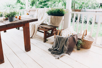 Cozy veranda with bench and flowers