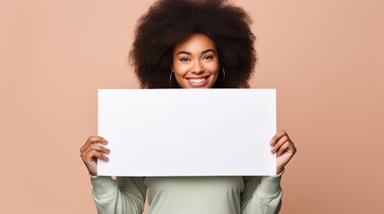 Young african american woman holding blank empty white paper.