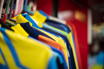 close-up of many soccer jerseys in a store
