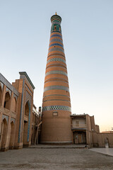 Islam Khoja Minaret against blue sky in Ichan-Kala old city