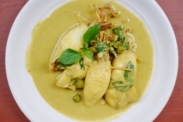 Indonesian traditional food named "cumi gulai padang" or squid curry from Padang West Sumatera, Gulai cumi khas Padang. 