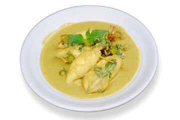 Indonesian traditional food named "cumi gulai padang" or squid curry from Padang West Sumatera, Gulai cumi khas Padang. 