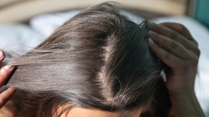Fototapeta premium Caucasian woman showing her hair.