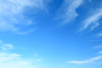 Perfect blue cloudy sky with fleecy cirrostratus clouds floating in round. Heaven paradise.