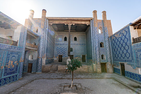 Khan palace with carved wooden column and walls with beautiful intricate ornament tiles in old city of Ichan-Kala