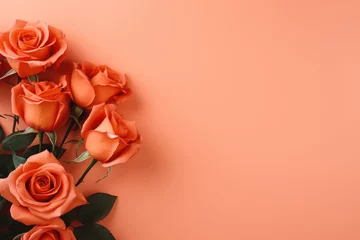 Fotobehang Orange rose flowers with green leaves on orange background, Valentine's day, mother's day, wedding and love concept © MrHamster