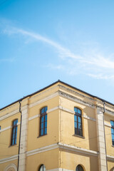 Fototapeta na wymiar View of facade of a building with a blue sky