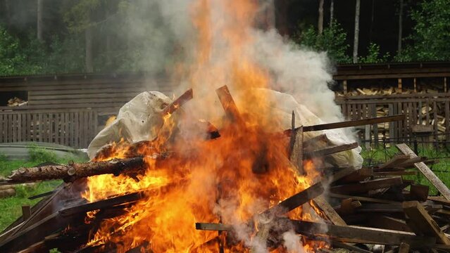 incineration of garbage on the farm. A big bonfire. Bonfire flames and smoke