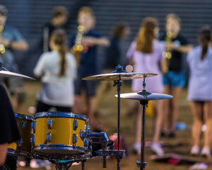 modified drum kit set up outside as part of a marching bands sideline percussion - obrazy, fototapety, plakaty