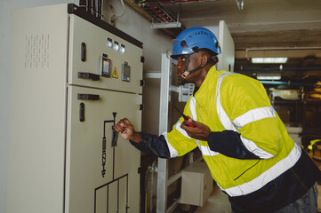engineering technician Setting up the solar panel inverter in the electrical room Service engineer...
