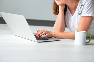 Young woman with computer indoors