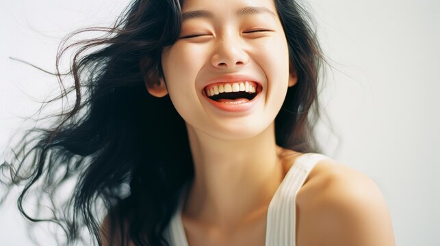 Joyful Korean Woman Laughing Close-up