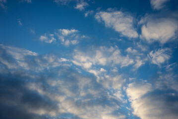 Naklejka na ściany i meble view of beautiful cloudy blue sky on sunset