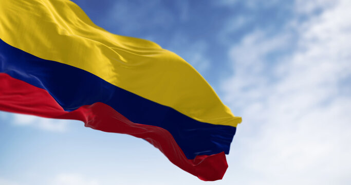 Colombia national flag waving in the wind on a clear day