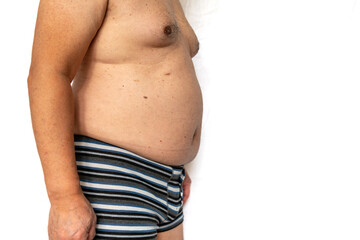 Naklejka premium Close up of body and belly of a overweight senior man isolated in white.