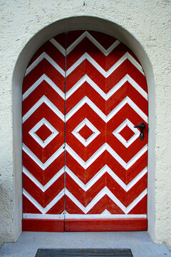 Red and white door of the upper castle in Feldkirch, Austria