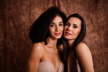 Photo of shiny sweet women wear beige lingerie no retouch skin cuddling touching cheeks isolated natural daylight fabric linen background