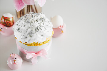 Traditional Easter cakes or sweet bread with hen figurines and eggs on white table. Top view