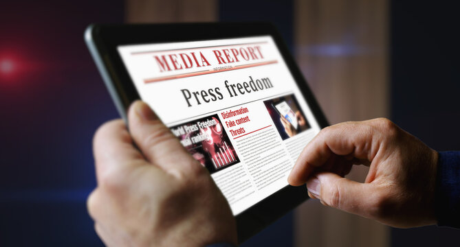 Press freedom newspaper on mobile tablet screen