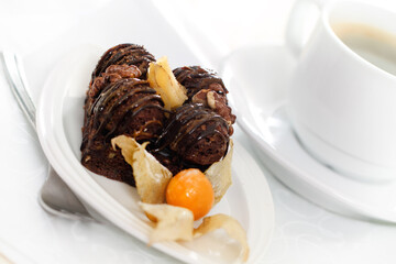 Delicious chocolate cake with coffee