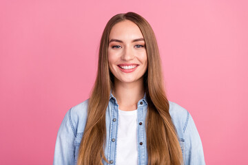 Photo portrait of pretty young girl look camera toothy smile wear trendy jeans outfit isolated on pink color background