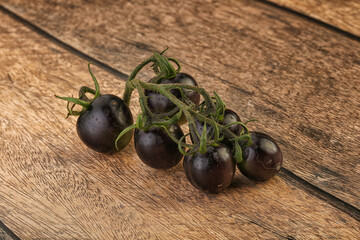 Ripe tasty black cherry tomato