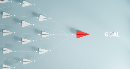 Leadership concept, red leader plane leading white plane, on blue background.