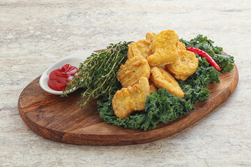 Crispy chicken nuggets with tomato ketchup