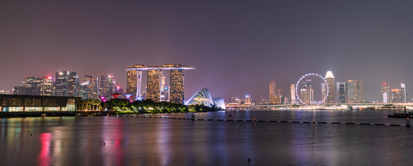 Tourists in the city park of singapore at night, landscape marina bay in Singapore city.